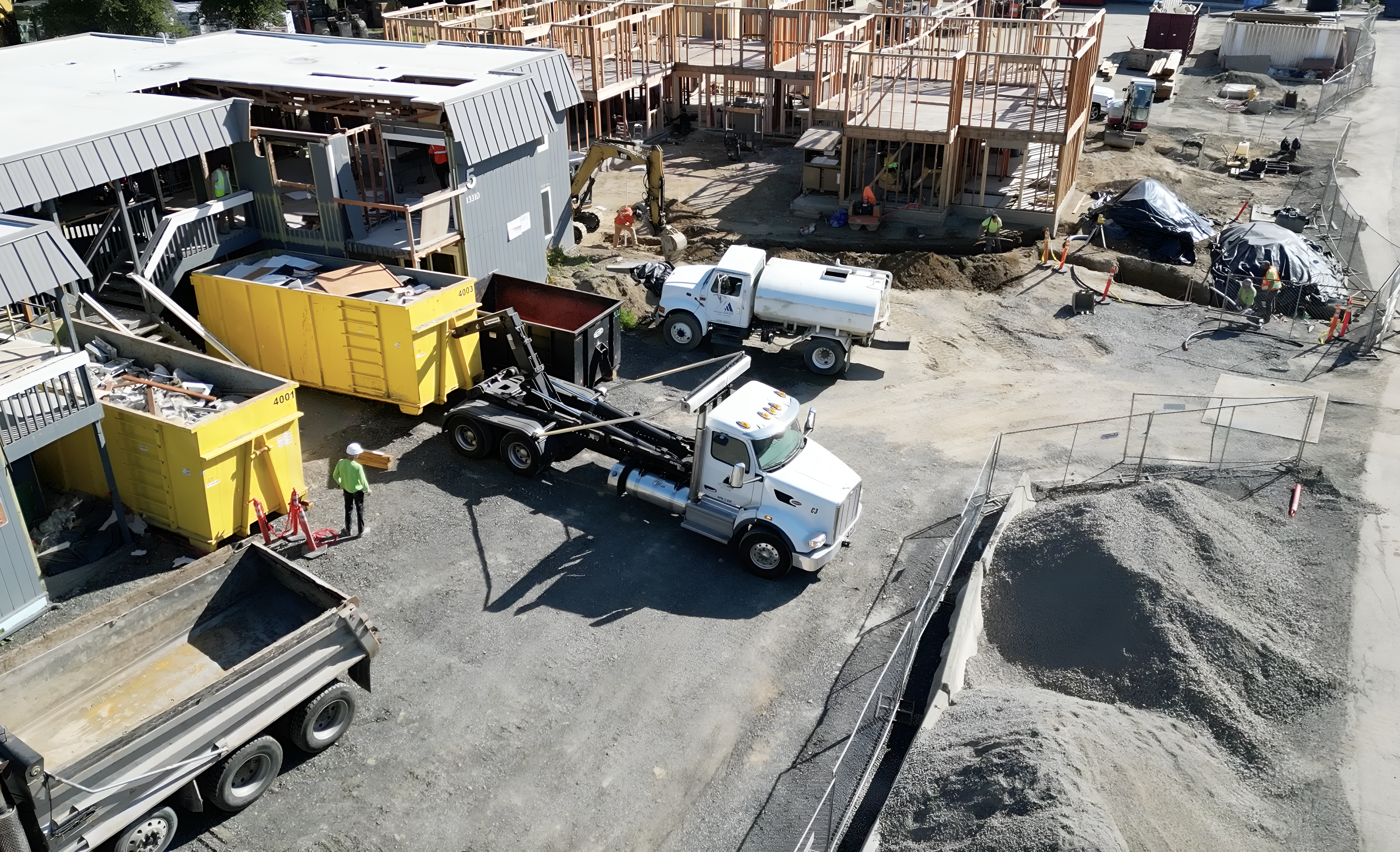 Dumpster parked at a job site
